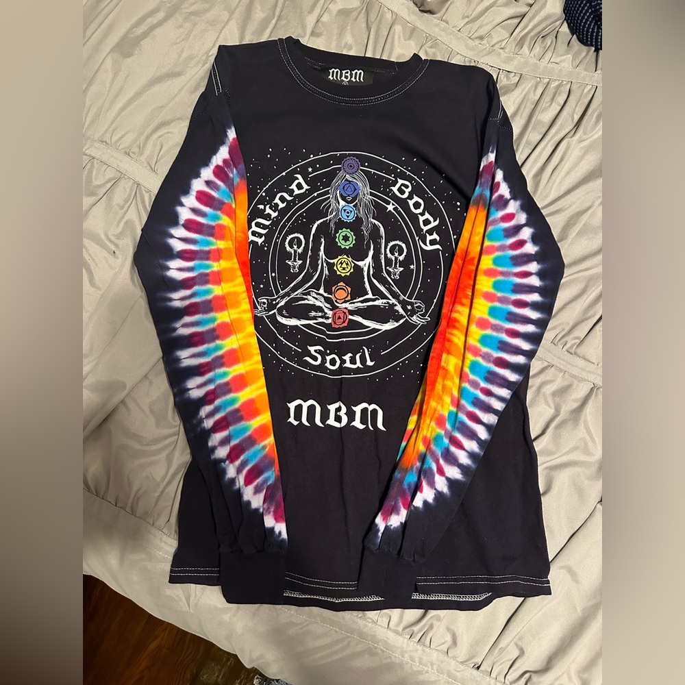 This long sleeve tea shirt was made by an artist named Marcos Alvarado